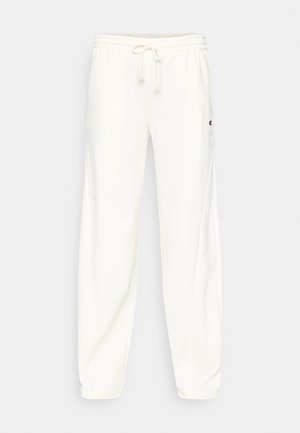 Vita mjukisbyxor med elastisk midjeresår och justerbar dragsko. Sidofickor och en liten logotypmärke på vänster lår.