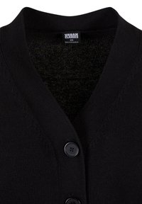 Sort strikket cardigan med V-hals, to sorte knapper og en label med teksten "Urban Classics XS, Made in Bangladesh."