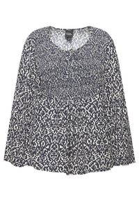 Blouse bleu marine avec un motif abstrait blanc, dotée d'un décolleté dégagé, d'un buste froncé et de manches longues. Tissu doux, coupe décontractée.