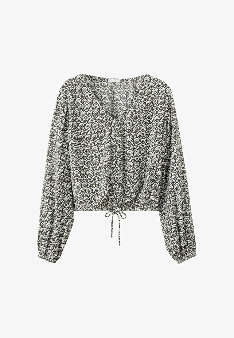 Blouse courte à manches longues, noire et blanche avec un motif, col en V et cordon ajustable à la taille.