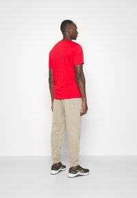 Nike Performance TAPER - Tréningruha alsók - khaki/khaki/(black)