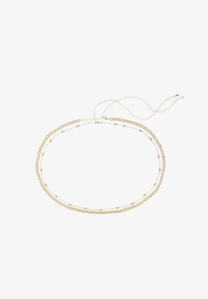 Dos delicados collares de cadena dorada, uno con pequeños eslabones ovalados distribuidos uniformemente, colocados planos con cierres ajustables entrelazados.