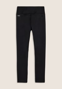 Leggings noirs en tissu extensible, dotés d'une large ceinture et d'un marquage minimal sur la hanche. Texture lisse et design près du corps.