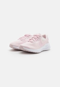 Pink athletic shoes with mesh upper, round toe, and white sole. Features laces and a swoosh logo on the side. Soft texture overall.