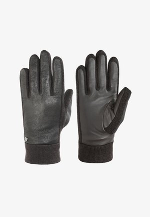 Zwarte leren handschoenen met ribbelige, donkere textiele manchetten, voorzien van een vingerloze ontwerp op één handschoen, textuur oppervlak en subtiele metalen accent.