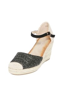 Scarpa espadrilles a zeppa intrecciata nera con punta beige, cinturino alla caviglia e tomaia testurizzata, caratterizzata da un tacco avvolto in juta naturale.