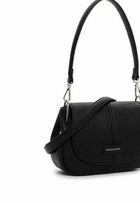 Black handbag made of textured leather with a rounded shape. Features a short handle, shoulder strap, and a front flap with embossed branding.