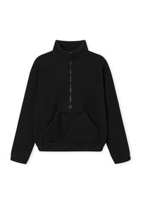 Pullover in pile nero con zip frontale a metà, colletto alto e tasca frontale. Presenta una texture morbida e una vestibilità comoda.