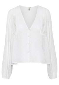 Weiße Bluse mit V-Ausschnitt, langen Ärmeln, strukturiertem Stoff mit Polka-Dots, Knopfverschluss und Spitzenverzierung entlang der Seiten.