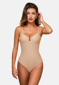 Nude jednoczęściowy strój kąpielowy z wąskimi ramiączkami i głębokim dekoltem w kształcie V. Gładka tekstura, wysokie wycięcia na nogach i prosty design bez zdobień.