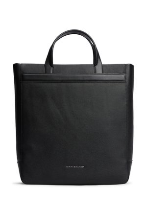 Bolso tote de cuero negro con asas cortas y pequeño logo de Tommy Hilfiger centrado cerca de la parte inferior del frente.