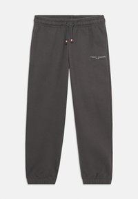 Grå bomulds sweatpants med elastisk talje, justerbar snor og hvid logo print på venstre lår. Korte ankler.