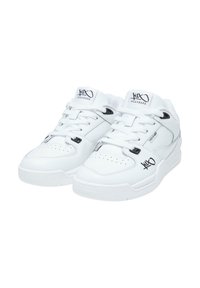 White sneakers with a low-top design, featuring a smooth leather upper, perforations on the toe, black accents, and logo on the tongue.