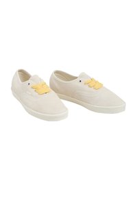Beige suede shoes with yellow textured laces, low-top design, round toe, and subtle stitching details. Rubber outsole in neutral color.