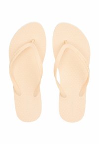 Ferskenfarvede flip-flops med struktureret fodseng, flad sål og tynde Y-formede stropper. Inkluderer diskret præget logo detalje.