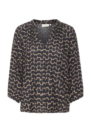 Blouse ample avec motif géométrique irrégulier noir et beige, manches trois-quarts, encolure ronde avec légère découpe en V et poignets élastiques.