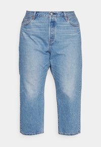 Vaqueros de denim azul claro con cintura alta, diseño de pierna recta, estilo de cinco bolsillos y un ligero desvanecimiento en la tela.