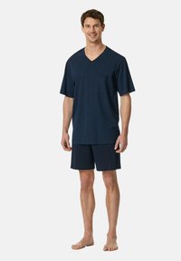 Haut à col en V à manches courtes bleu marine avec motif à carreaux, poche avant, assorti à un short bleu marine, le tout en tissu doux.