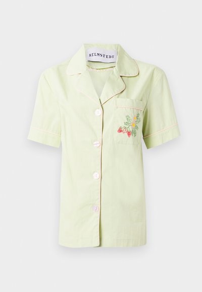 Short-sleeve light green cotton shirt with pink piping, featuring a front pocket adorned with colorful floral embroidery and five buttons.