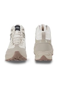 Beige hiking shoes with a textured upper, reinforced toe cap, and a contrasting brown outsole. Features durable laces and padded collar.