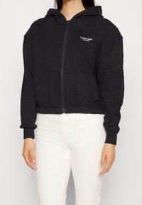 Calvin Klein Jeans Mikina na zip - black