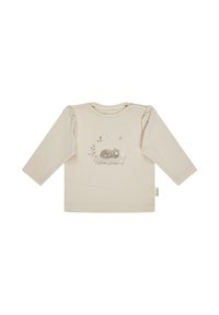 Cream long-sleeved cotton shirt with gathered shoulders, featuring a printed illustration of a sleeping cat, butterflies, and greenery.