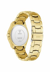 Orologio in acciaio inox dorato con finitura lucida, bracciale a maglie esagonali e quadrante circolare. Presenta un movimento dell'orologio visibile e il logo sul retro.
