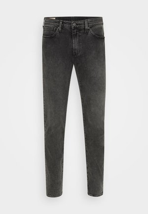 Slim-fit jeans w ciemnoszarym dżinsie, z pięcioma kieszeniami, zasuwaną rozporkiem oraz lekko wyblakłą teksturą z kontrastującym przeszyciem.