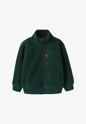 Grønn fleecejakke med høy krage, full glidelås og ribbestrikkede mansjetter. Har teksturert stoff og en glidelåslomme på brystet.