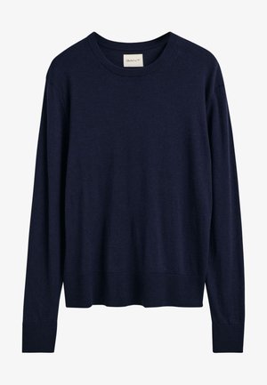 Granatowy sweter z pulowerem, wykonany z miękkiej dzianiny. Posiada okrągły dekolt, długie rękawy oraz ściągacze na mankietach i dole. Brak widocznych wzorów.