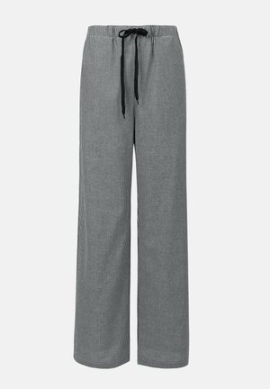 Black and white checkered wide-leg pants with an elastic waistband and drawstring, featuring a soft, lightweight fabric texture.