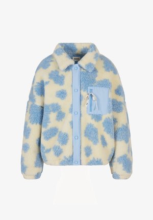 Kurtka polarowa o jasnółółtej bazie z niebieskim wzorem w kropki, wyposażona w niebieską kieszeń, zapięcie na guziki oraz miękkie, teksturowane wykończenie.