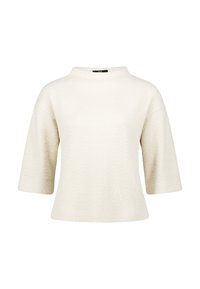 Kortærmet cremebluse med et fiskebensmønster, rund halsudskæring og en afslappet pasform. Fremstillet af et blødt, struktureret materiale.