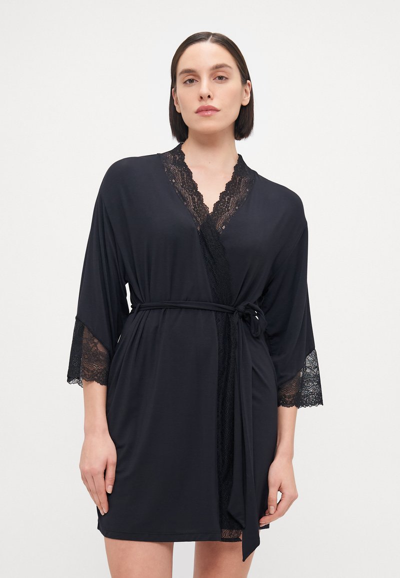 Black kimono-style robe made of soft fabric, featuring lace trim on sleeves and neckline, with a tying belt at the waist for fit.