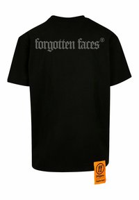Black cotton t-shirt with short sleeves. Features "forgotten faces" in silver text on the back and an orange rectangular label at the hem.