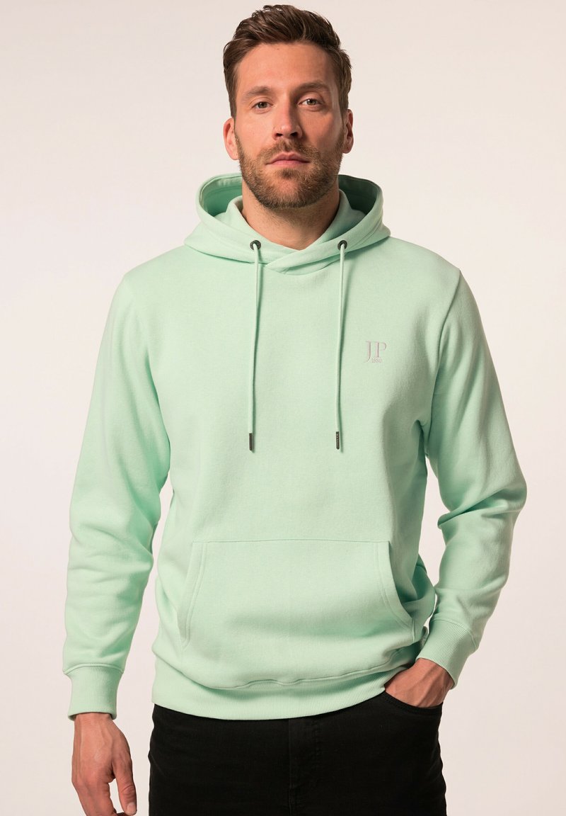 Felpa verde menta con cordini regolabili, tasca frontale e discreto dettaglio del logo. Tessuto morbido con vestibilità rilassata e polsini a costine.