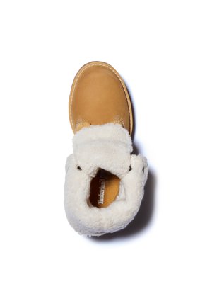 Stivaletto alla caviglia in pelle color cuoio con fodera in pile bianco, visto dall'alto su sfondo bianco.