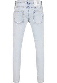 Svijetloplave skinny traperice s glatkom teksturom, pet džepova i minimalističkim dizajnom uz suptilno blijeđenje i detalje šivanja.