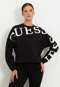 Guess - FRONT-UND SEITENLOGO - Sudadera - schwarz Imagen en miniatura 1