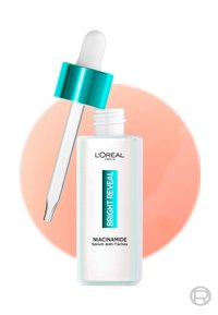 Sérum Niacinamide Bright Reveal de L'Oréal dans un flacon transparent avec un compte-gouttes blanc et un capuchon turquoise ; présente une étiquette en texte audacieux.