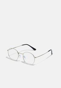 Ochelari de metal rotunzi cu un cadru subțire din argint, lentile clare și brațe negre cu vârfuri din cauciuc pentru confort. Design minimalist.