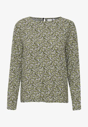 Long-sleeve blouse in green, featuring a floral pattern of white and black flowers. Rounded neckline with a button closure at the back.