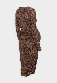 Long-sleeve dress featuring a brown and black zebra print, ruched side detailing, and a fitted silhouette. Smooth, stretchy fabric.