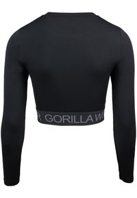 Zwarte lange mouwen crop top van rekbaar materiaal, voorzien van een grijze elastische band met "Gorilla Wear" tekst langs de onderrand.