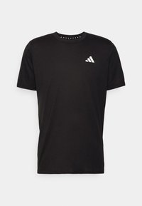 Svart bomulls t-shirt med korta ärmar, rund hals och en vit Adidas-logotyp på vänster bröst. Har ett texturerat triangelmönster innanför halsen.