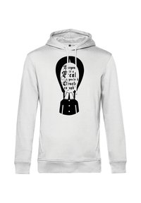 Felpa bianca con cappuccio caratterizzata da una grafica nera di una mongolfiera con il testo "Tutti sono un po' strani se guardi abbastanza da vicino" in un font stilizzato.