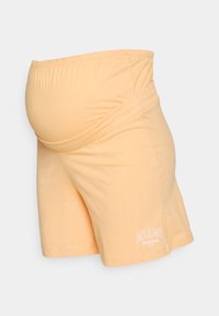 Calções de maternidade laranja claro feitos de tecido suave, com uma cintura elástica e o texto "MIAMI SOUTH BEACH" em branco.
