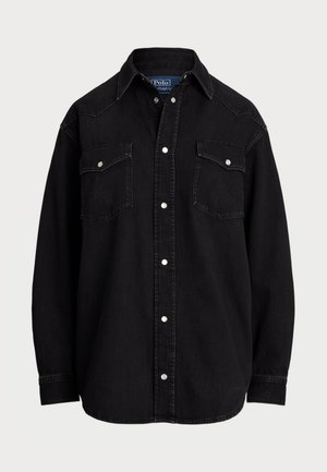 Black denim shirt with long sleeves, pointed collar, two chest pockets, and silver snap buttons, featuring a straight cut and soft texture.