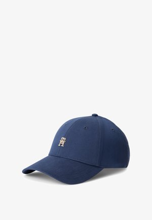 Casquette de baseball bleu marine avec visière incurvée et petit logo doré "TH" au centre avant sur fond blanc.