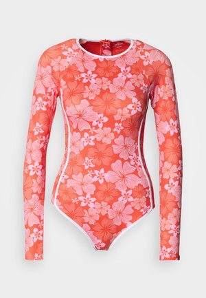 Long-sleeve red swimsuit featuring an all-over pink floral pattern, zip closure at the back, and white accent detailing along the edges.